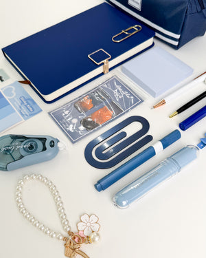 Blue bookish stationery gift for her with notebook, sticky notes, bookmark, pens and aesthetic accessories.
