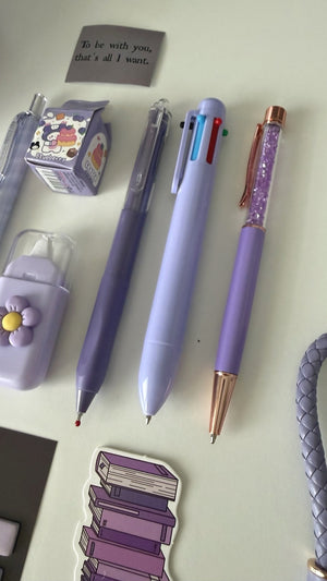 Close-up of pastel pens and stationery accessories included in the Essential Purple Stationery Gift Set