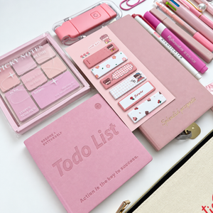 Close-up of pink to-do notebook, A6 lined journal, decorative sticky notes and Bestie canvas pouch in a curated stationery gift set.