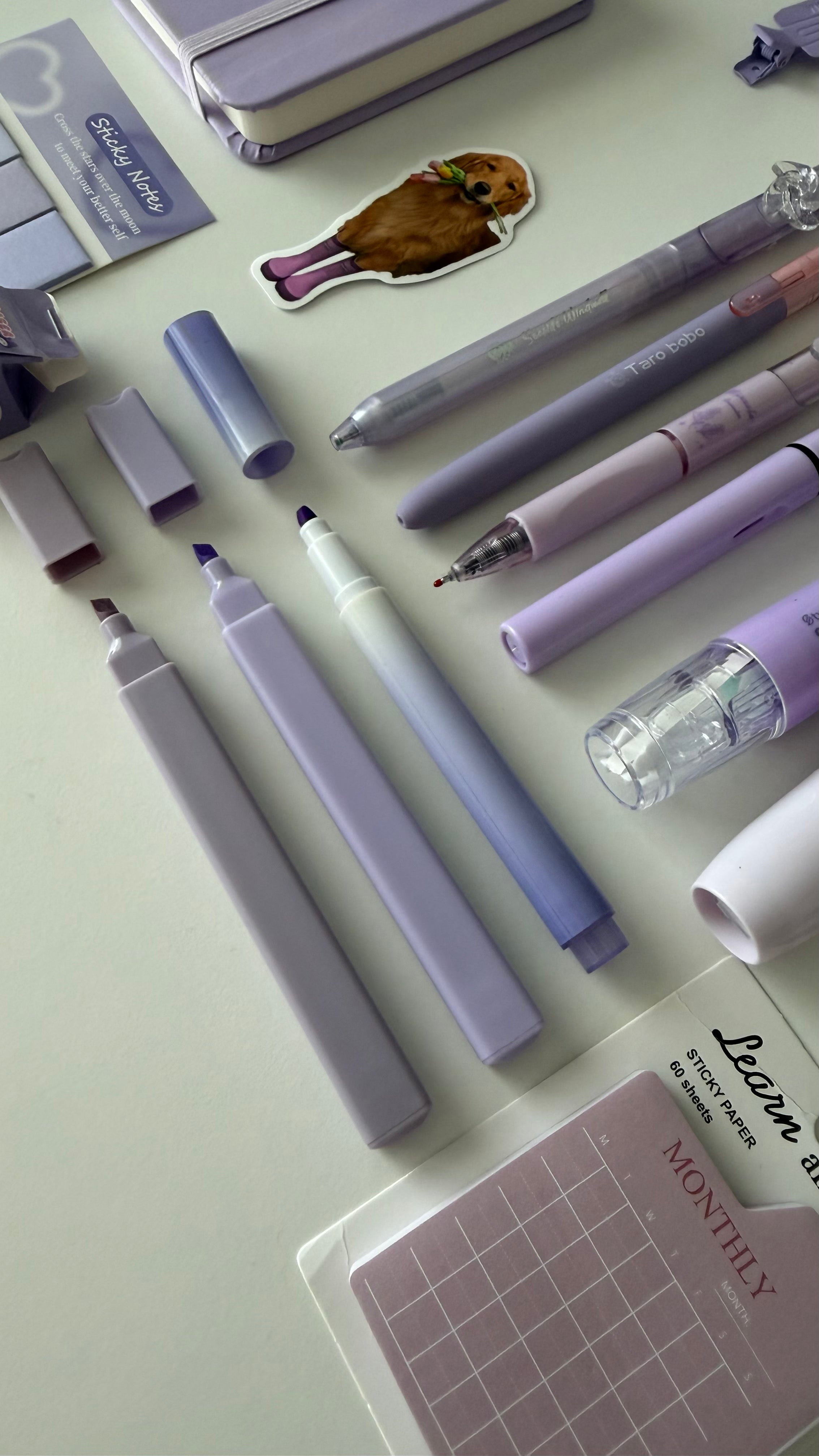 Close-up of pastel pens, highlighters, and markers included in the Essential Purple Stationery Bundle