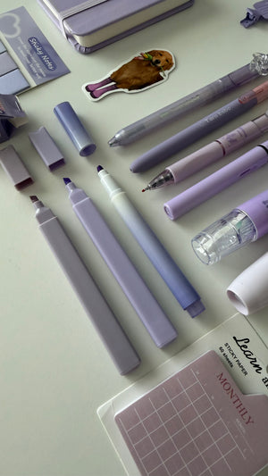 Close-up of pastel pens, highlighters, and markers included in the Essential Purple Stationery Bundle