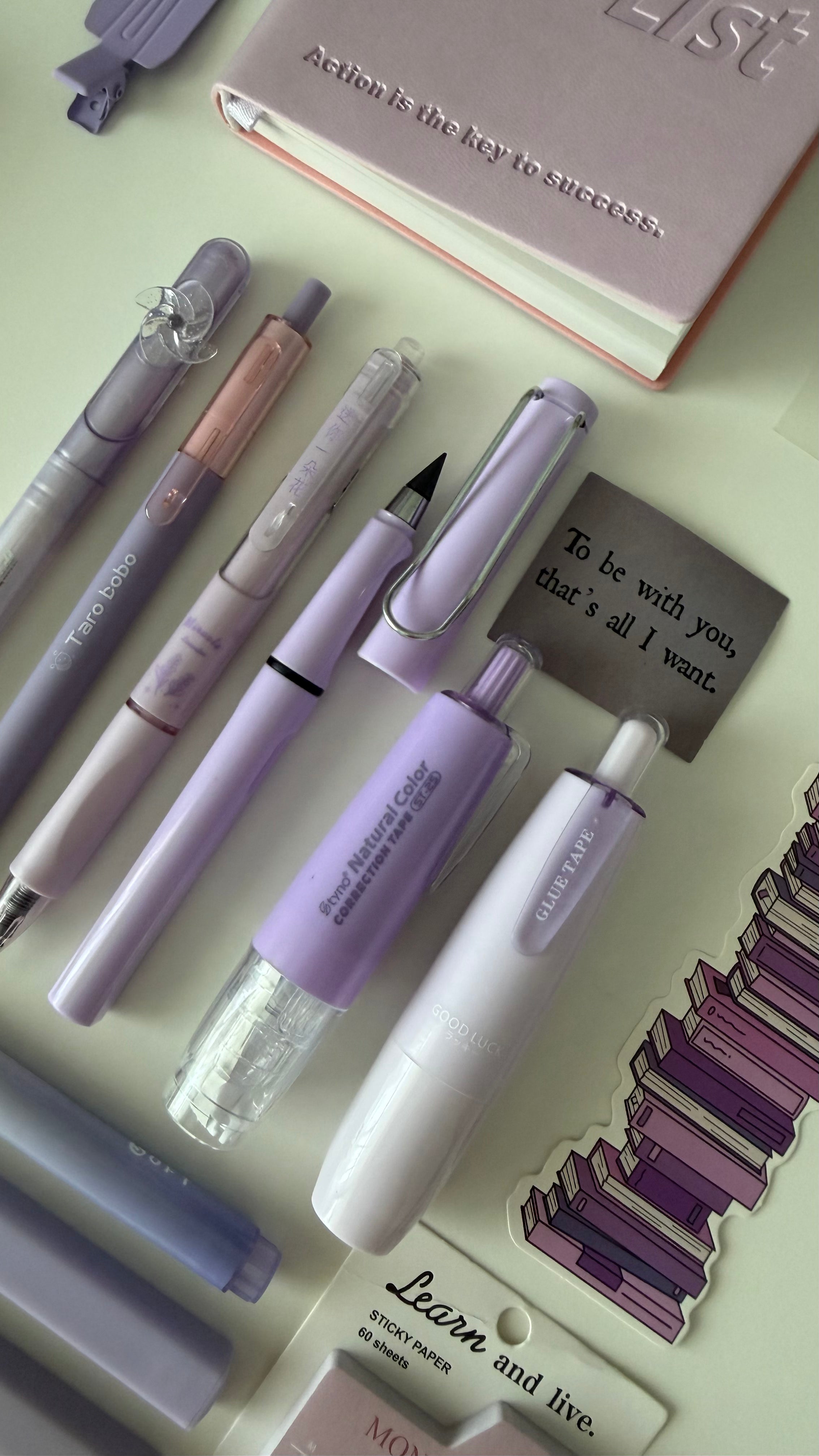 Close-up of pastel pens, highlighters, and markers included in the Essential Purple Stationery Bundle