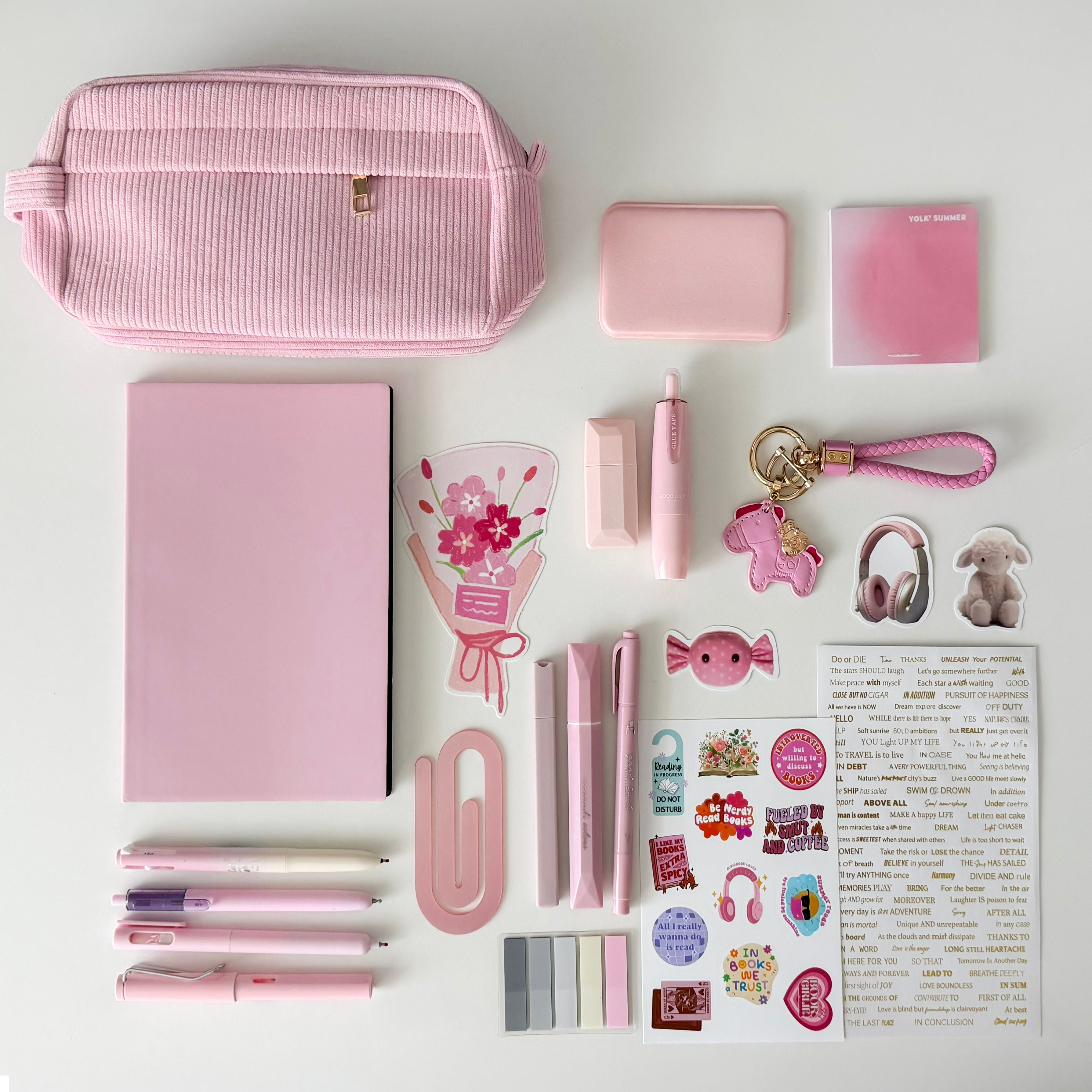 Pink Stationery Gift Bundle featuring a corduroy pencil pouch, notebook journal, pastel pens, sticky notes, bookmarks, stickers, keychain charm, and cute desk accessories for book lovers and journaling. Bookish gift set.