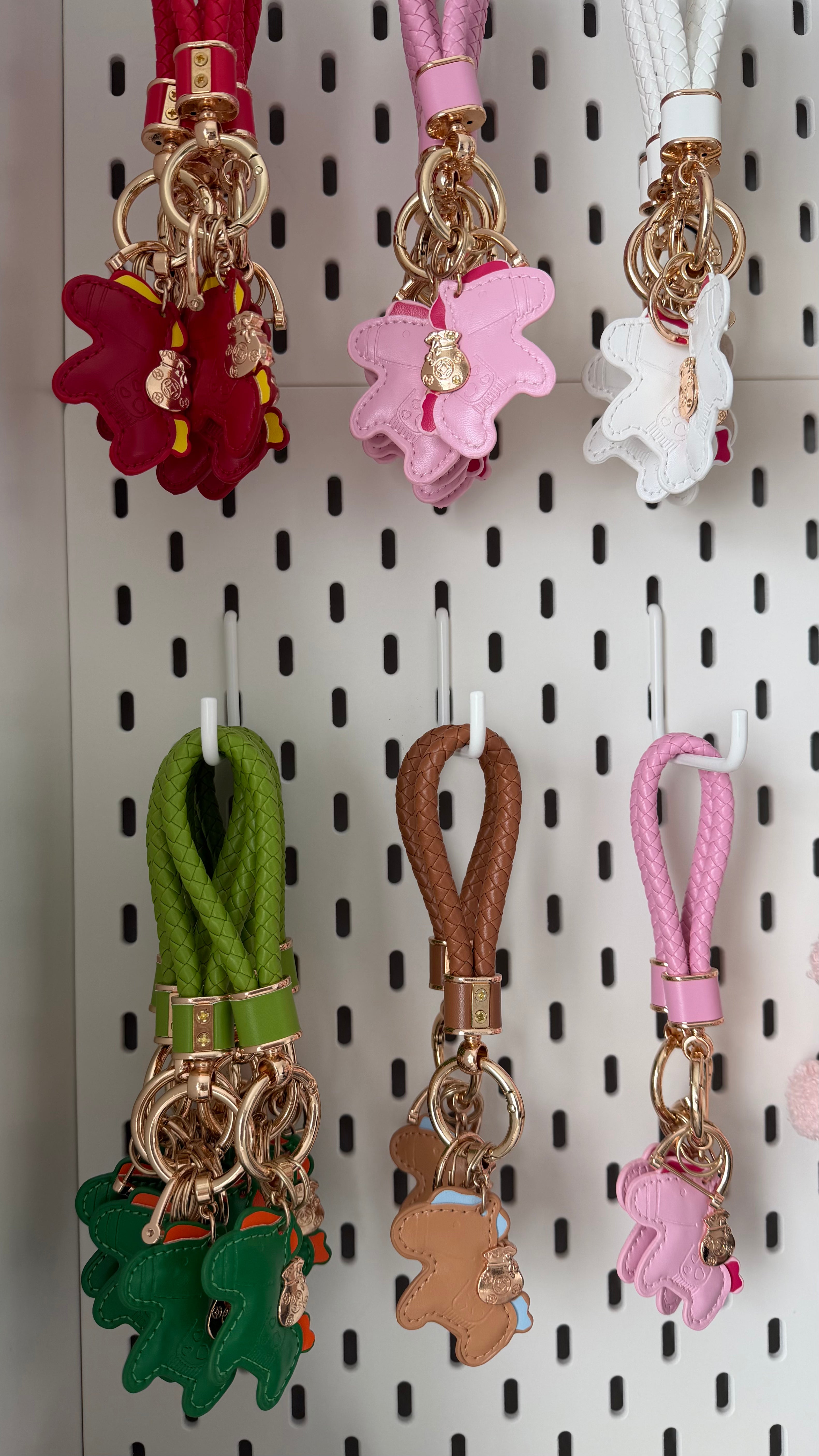 Pony bag charm keychain with braided strap and gold-tone hardware