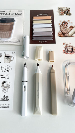 Coffee-inspired stationery essentials from the Morning Coffee Stationery Gift Bundle, including a Café Latte memo pad, sticky notes, coffee stickers, two highlighters, LED reading light, and an eternal pencil for journaling.