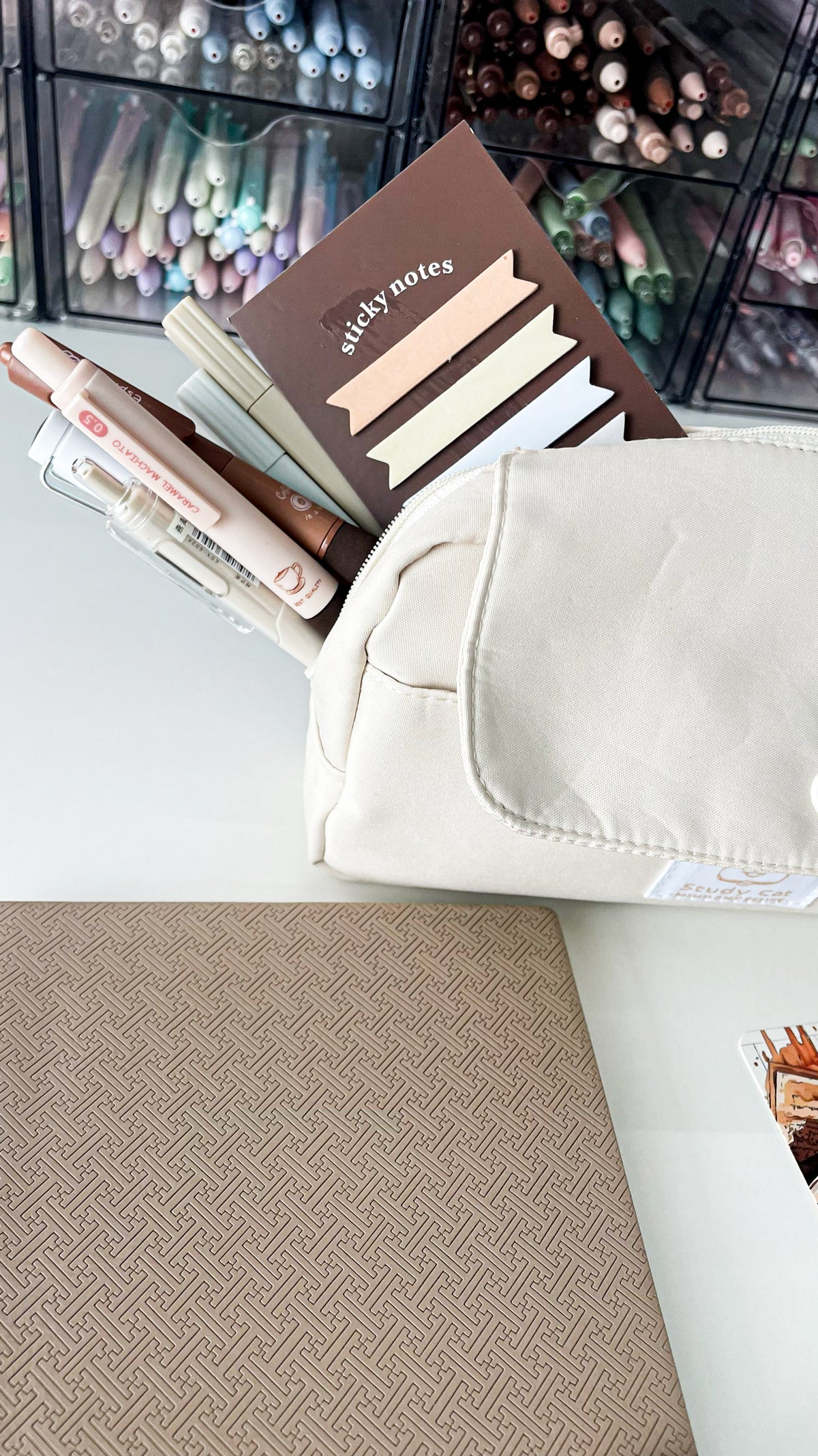 Cream corduroy pencil pouch filled with coffee-themed gel pens, sticky notes and stationery from the Morning Coffee Stationery Gift Bundle.