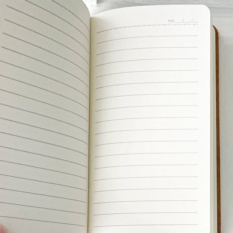 Open A6 notebook from a pink essential stationery set bookish bundle