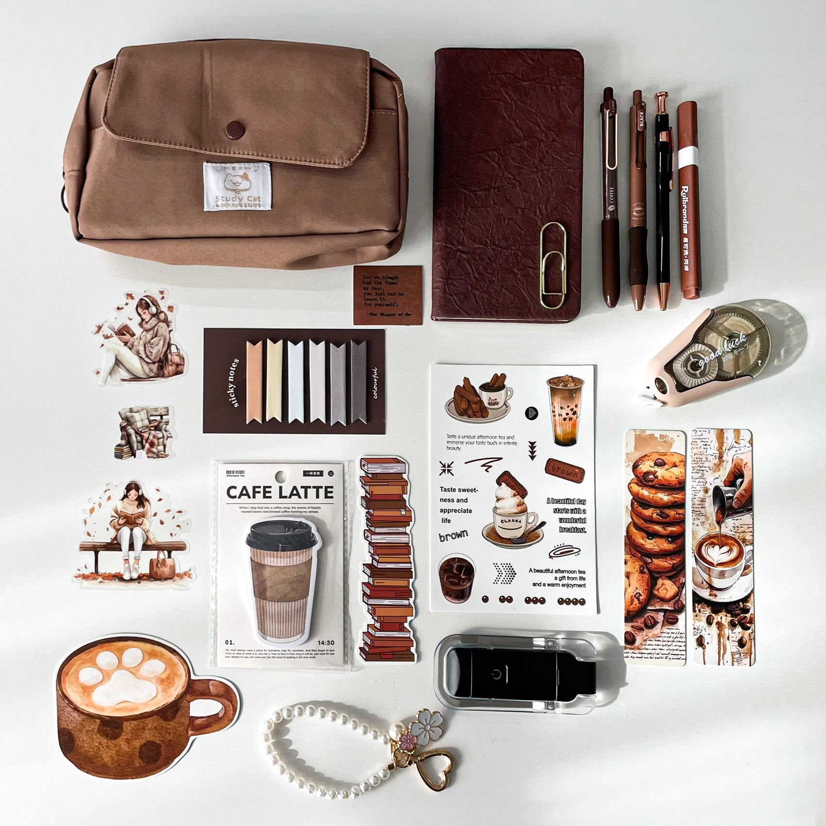 Premium coffee-themed stationery gift bundle with A6 notebook, premium pencil pouch, coffee gel pens, LED reading light, bookmarks, stickers, and stationery accessories on a white background.
