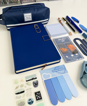Blue aesthetic gift bundle with navy notebook, pencil pouch, pens, sticky notes, bookmarks and coordinated stationery accessories.