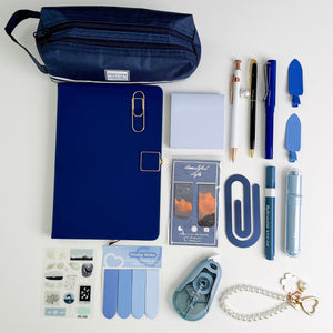 Blue stationery gift bundle with notebook, pencil pouch, pens, sticky notes, bookmarks and bookish accessories.
