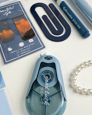 Blue stationery gift for coworker with bookmarks, highlighter, correction tape and aesthetic accessories.