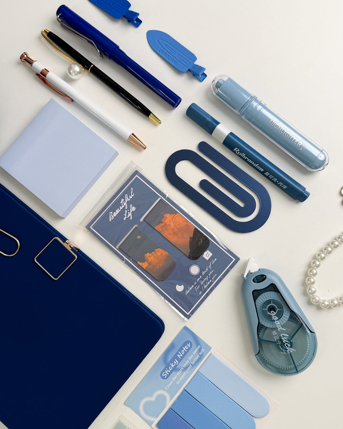 Blue stationery gift for sister with pens, highlighters, sticky notes, bookmarks and aesthetic accessories for journaling and reading.