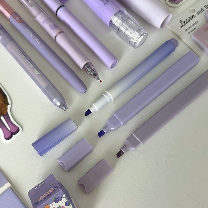 Close-up of pastel pens, highlighters, and markers included in the Essential Purple Stationery Bundle