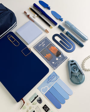 Blue stationery gift bundle for stationery lovers with notebook, pens, sticky notes, bookmarks, highlighters and aesthetic accessories.